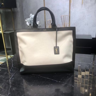 YSL Yves Saint laurent聖羅蘭 SLP 新款帆布配皮購物袋SHOPPING TAG帆布和皮革托特包 ，搭配管狀皮革手柄，和飾以金屬YSL字母標誌的可拆卸皮革標籤。 尺寸 41.5 34.0 14.0 C